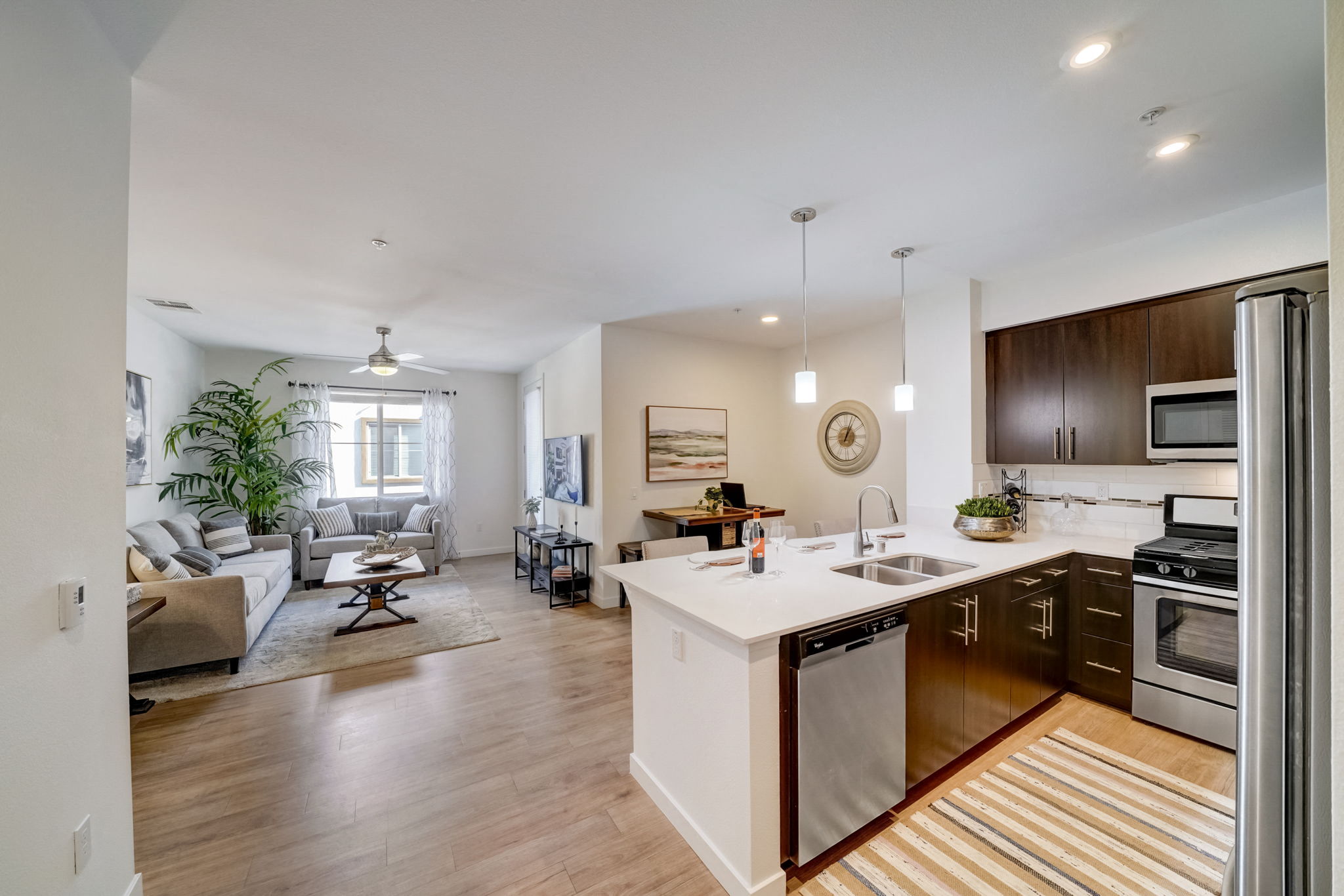 Spacious open-plan kitchen and living room with a cozy couch and dining table